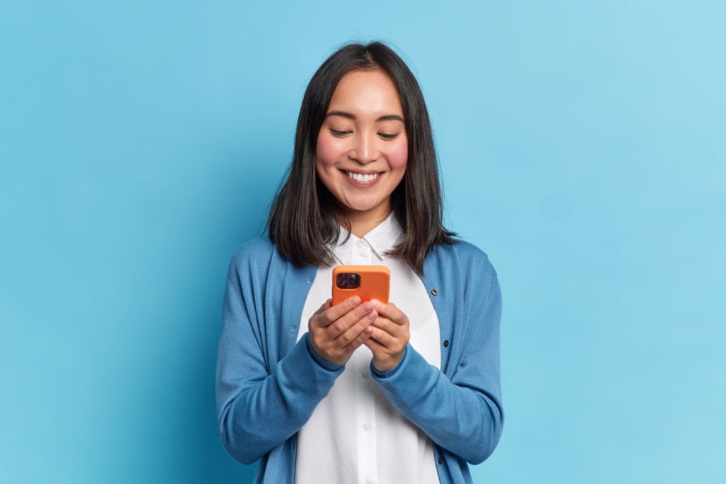 Woman receiving promotional text messages from SMS platform in Portland